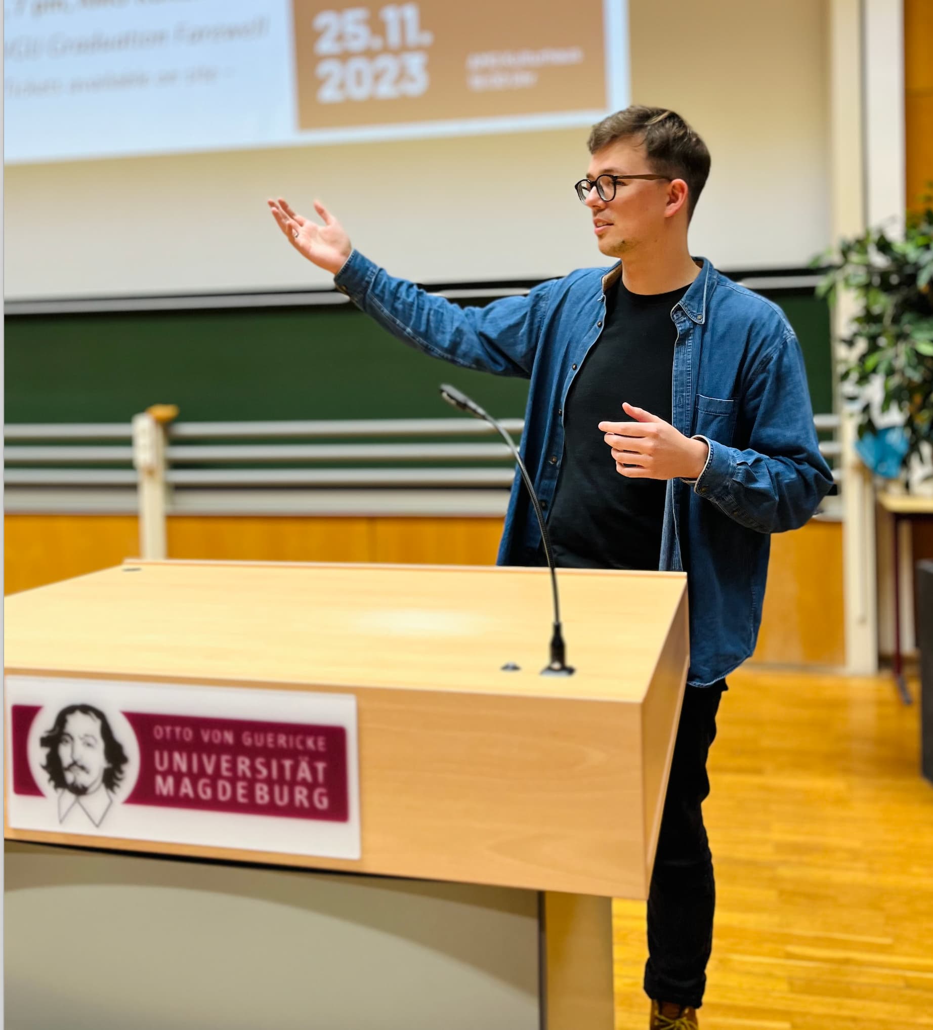 Photo of Dmitry Dugarev defending his master's thesis